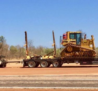 machinery the back of a truck on outback road